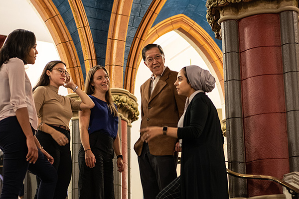 Professor Derald Wing Sue speaks with his student at Teachers College