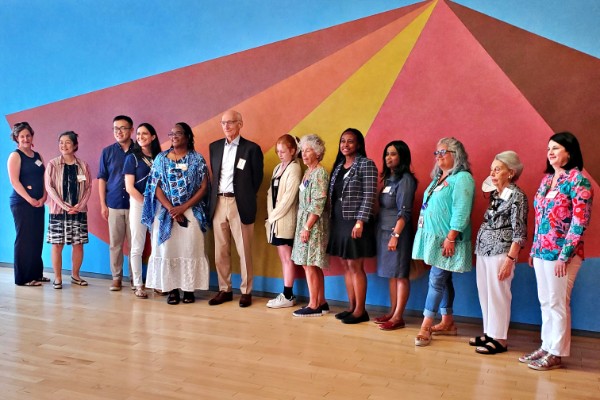 Teachers College staff standing in front of art at MASS MoCA